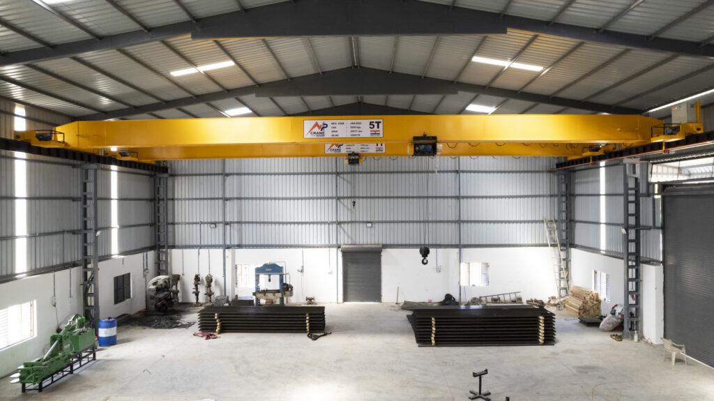 Double girder EOT crane manufactured by MP Crane India installed in an industrial plant in Ahmedabad